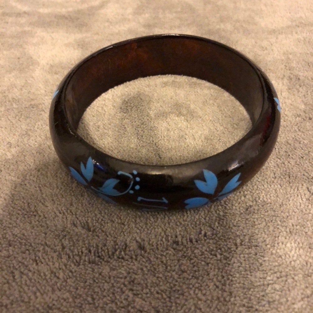 Brown wooden bracelet with blue painted flowers